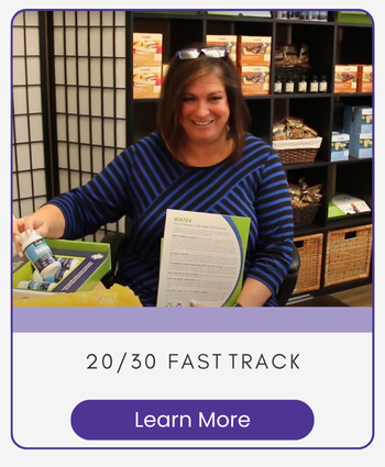 A woman at a desk with weight loss products