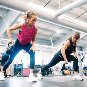Arena Club Personal Trainer Wendy O'Bryant with a client on the fitness floor