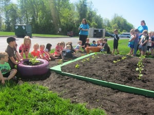 Kids gardening outside